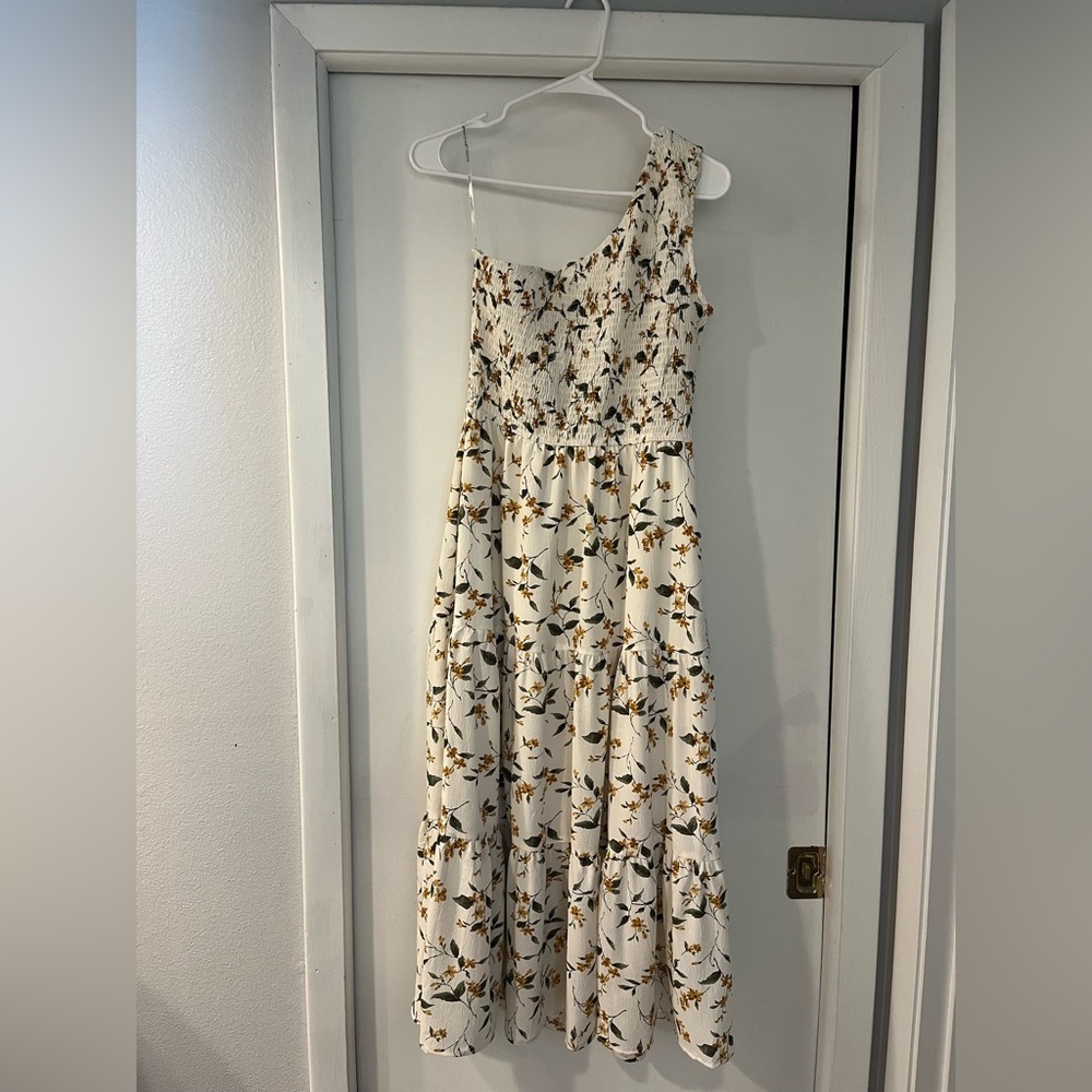 White off the shoulder dress with green leaves and gold flowers